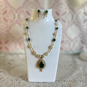 Whispering Woodland Pearl Necklace Set Green Gem Green synthetic onyx stone pendant on a white freshwater pearl necklace white pearls on a golden chain with matching earrings